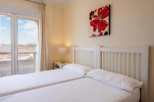 Posteľ alebo postele v izbe v ubytovaní Villas y Apartamentos El Sultan