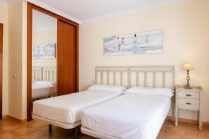 Posteľ alebo postele v izbe v ubytovaní Villas y Apartamentos El Sultan