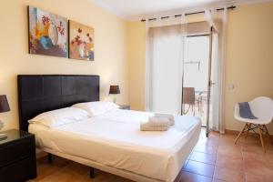 Posteľ alebo postele v izbe v ubytovaní Villas y Apartamentos El Sultan
