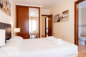 Posteľ alebo postele v izbe v ubytovaní Villas y Apartamentos El Sultan
