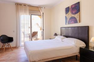 Posteľ alebo postele v izbe v ubytovaní Villas y Apartamentos El Sultan