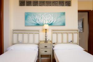 Posteľ alebo postele v izbe v ubytovaní Villas y Apartamentos El Sultan