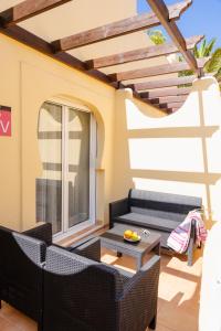 Posedenie v ubytovaní Villas y Apartamentos El Sultan