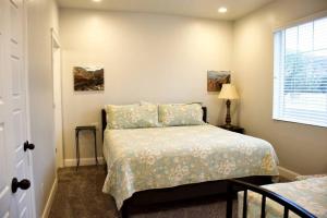a small bedroom with a bed and a window at ZC2 Home Base for Zion With Two Masters in La Verkin