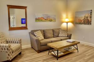 a living room with a couch and a table at ZC2 Home Base for Zion With Two Masters in La Verkin