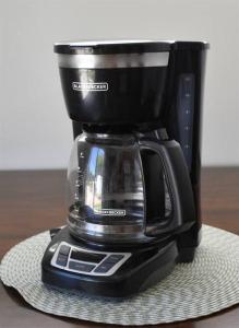 a black coffee maker sitting on top of a napkin at ZC2 Home Base for Zion With Two Masters in La Verkin