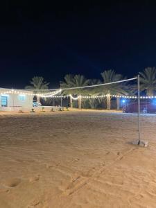 a soccer goal on the beach at night at Spacious Farm Stay with 3 bedroom & relaxing view in Remah