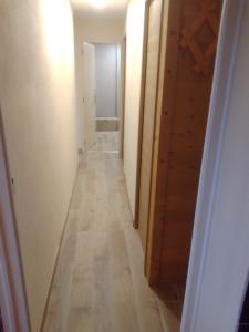 a hallway of a room with a wooden floor at Appt Ponteil in Les Deux Alpes
