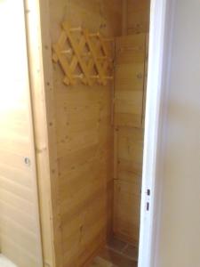 a closet with wooden paneling in a room at Appt Ponteil in Les Deux Alpes