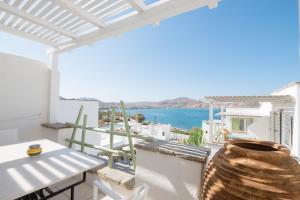 a balcony with a view of the ocean at Anthos Apartments in Naousa