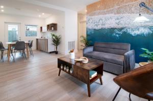 a living room with a couch and a table at The Lauderdale Boutique Hotel in Fort Lauderdale