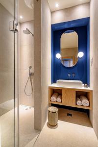 a bathroom with a sink and a mirror at Luxury Villa Hvar Deluxe Palace 1 with heated pool, gym and sauna in Hvar +58 photos