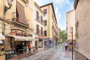 a street in an old town with buildings at CASA SAN MATIAS in Granada