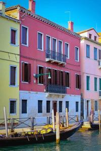 a group of buildings with boats in the water at Apt Ponte Dei Greci in Venice
