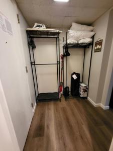 a room with two bunk beds and a wooden floor at Cedar Lodge Condo with Lake Winnipesaukee Views; close to Weirs Beach!! in Laconia +9 photos