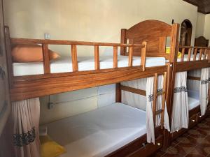 Postel nebo postele na pokoji v ubytování Hostel Roraima