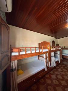 a room with two bunk beds in a house at Hostel Roraima in Boa Vista