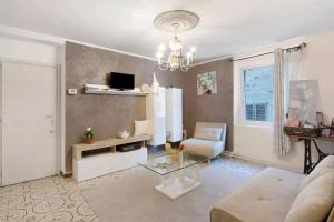 a living room with a couch and a glass table at MARY HOUSE @ in Sondrio