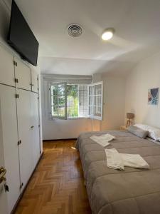 Ένα ή περισσότερα κρεβάτια σε δωμάτιο στο Casabella Mendoza