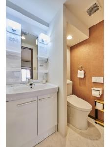 a bathroom with a white sink and a toilet at Kyoto Hostel family room / Vacation STAY 8181 in Nishinotōindōri