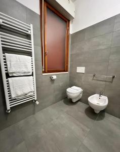 a bathroom with a toilet and a sink at ZAPPI CYCLING HOTEL in Riolo Terme +77 photos