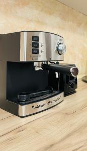 a toaster oven sitting on top of a counter at Apartament CHIC in Vatra Dornei +14 photos