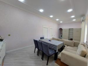 a living room with a table and a couch at Lenkeran Seaside in Lankaran