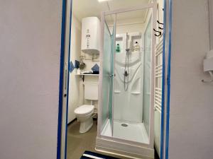 a bathroom with a shower and a toilet at 1912 - Blue Room - old town in Locarno