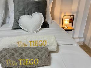 Posteľ alebo postele v izbe v ubytovaní VILLA TIEGO
