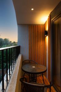 a table and two chairs on a balcony at Stunning 3 Bed Apartment in London