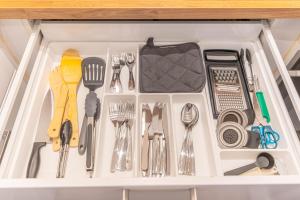 a drawer filled with utensils in a kitchen at Apartment Leverkusen in Leverkusen