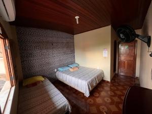 Postel nebo postele na pokoji v ubytování Hostel Roraima
