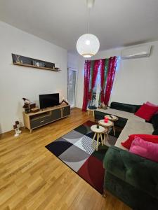a living room with a couch and a table at Apartman AURORA CETINJE in Cetinje
