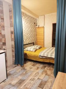 Ένα ή περισσότερα κρεβάτια σε δωμάτιο στο ValueStay Cascade - Studio Apartments Ararat View & City Center