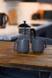 a coffee maker and two cups on a table at Boutique Penthouse Apartment in Historic Hull HU1 - sleeps 6 in Hull