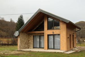 a small house with a large window at The View Luxury Chalet in Jahorina