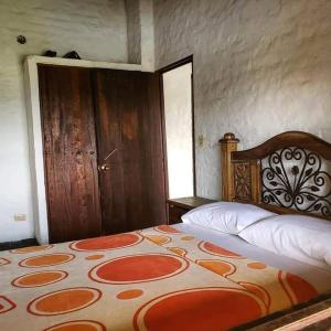 Voodi või voodid majutusasutuse Finca Sanfelipe toas