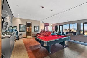 a living room with a pool table in it at StripViewSuites Ultimate Luxury Penthouses Full Strip View & Balcony in Las Vegas