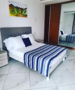 Postel nebo postele na pokoji v ubytování Residencial Santo Amaro