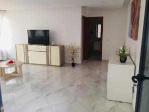 TV a/nebo společenská místnost v ubytování Residencial Santo Amaro