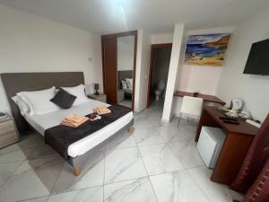 Postel nebo postele na pokoji v ubytování Residencial Santo Amaro