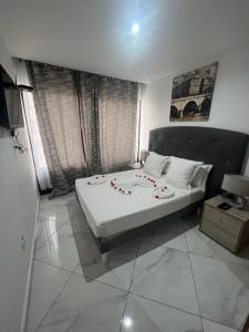 Postel nebo postele na pokoji v ubytování Residencial Santo Amaro