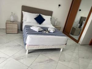 Postel nebo postele na pokoji v ubytování Residencial Santo Amaro