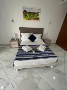 Postel nebo postele na pokoji v ubytování Residencial Santo Amaro