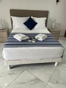 Postel nebo postele na pokoji v ubytování Residencial Santo Amaro