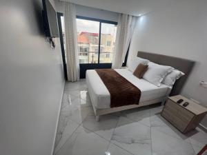 Postel nebo postele na pokoji v ubytování Residencial Santo Amaro