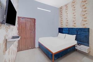 Postel nebo postele na pokoji v ubytování Flagship Hotel Sai Anant