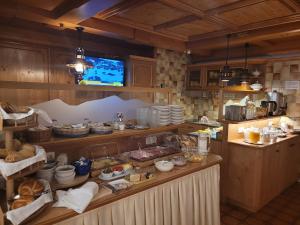 a kitchen filled with lots of food on a counter at Hotel Garni Dias in Kappl