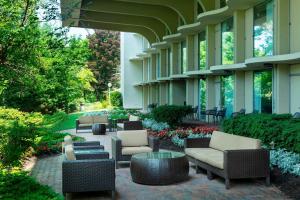 a building with chairs and tables in a courtyard at Boston Marriott Newton in Newton