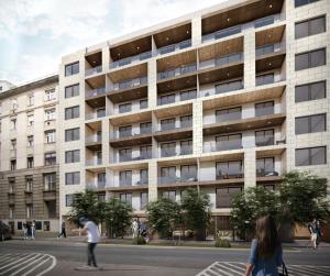 een man op een skateboard voor een gebouw bij RiverCity Apartments in Boedapest